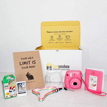 The Picture Perfect Polaroid Camera Gift Set A gift set with a Fujifilm polaroid camera, protective case, photo album, picture frame and two packs of polaroid photo film