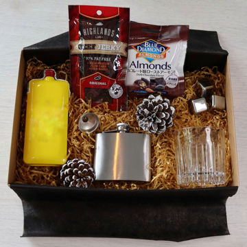 Scotch whisky gift box with a bottle of J&B scotch, a hip flask, drinking glass, metal ice cubes & snacks Scotch whisky gift box with a bottle of J&B scotch, a hip flask, drinking glass, metal ice cubes & snacks