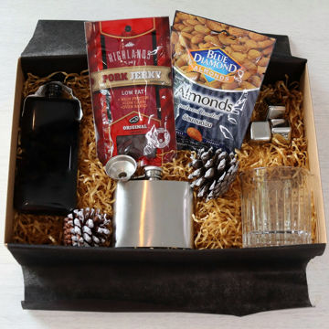 Johnnie Walker Black Label Whiskey Set Gift Box A gift box containing Johnnie Walker Black Label, a hip flask, metal ice cubes, a glass and some bar snacks.
